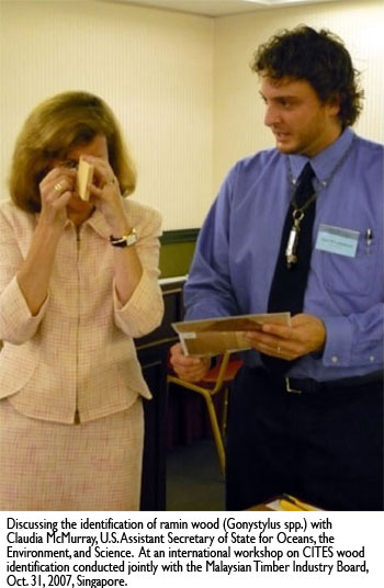 Dr. Alex C. Wiedenhoeft, Discussing the identification of ramin wood (Gonystylus spp.) with Claudia McMurray, U.S. Assistant Secretary of State for Oceans, the Environment, and Science.  At an international workshop on CITES wood identification conducted jointly with the Malaysian Timber Industry Board, Oct. 31, 2007, Singapore.